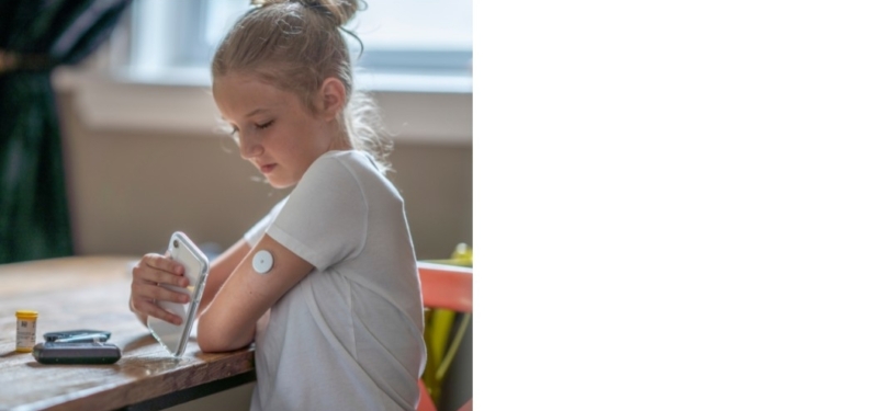 girl with glucose monitor
